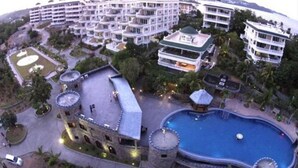 A resort with multiple buildings, a swimming pool, and a castle-like structure. - Lingganay Boracay Hotel Resort (Boracay Island)