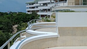 A modern hotel with multiple balconies and a curved terrace. - Lingganay Boracay Hotel Resort (Boracay Island)