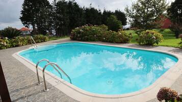 Outdoor pool, open 9 AM to 11 PM, sun loungers