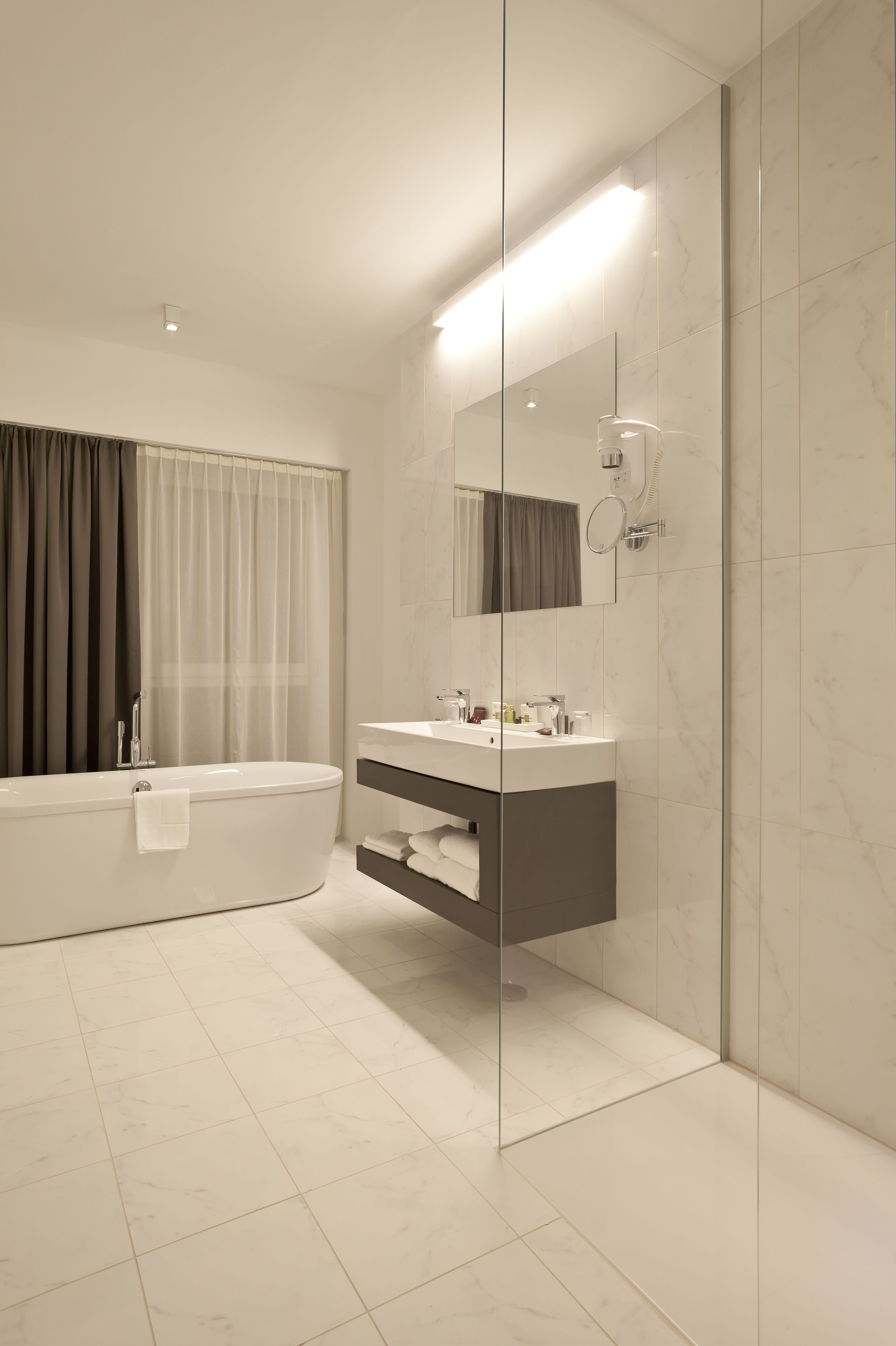 hair dryer, bathrobes, bidet, towels