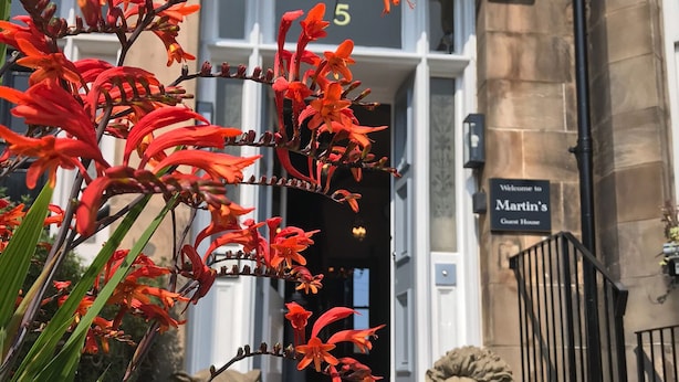 A building entrance with a sign reading "Welcome to Martin's Guest House" and a number "5" above the door. - Martin's Guesthouse (Edinburgh)