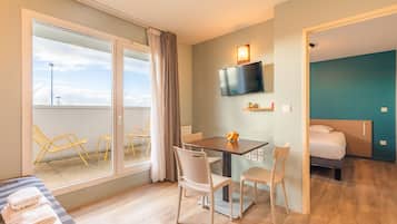 Standard Apartment | Living area | Flat-screen TV
