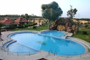 Outdoor pool, free cabanas, sun loungers - Confident Amoon - The Glamour Spa and Resort (Hoskote)