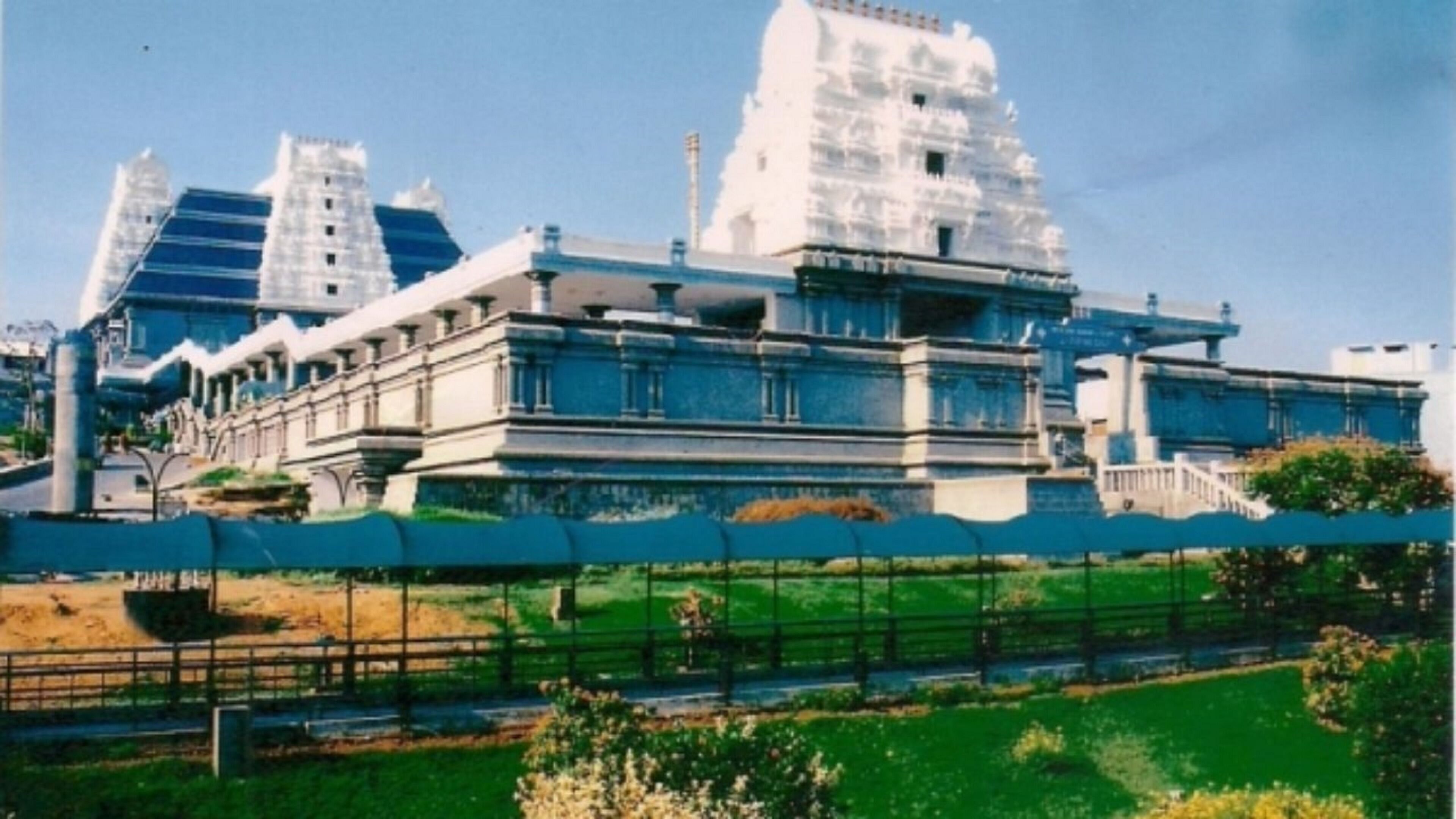 A large, historic building with multiple levels and a prominent central structure.