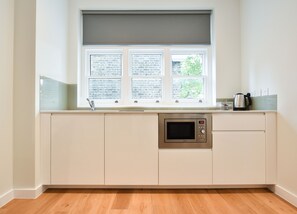 Premium Deluxe Studio Apartment | Private kitchen | Full-sized fridge, microwave, stovetop, coffee/tea maker - St James House Serviced Apartments by Concept Apartmentsv (London)