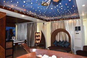 Coral Garden Suite | Minibar, in-room safe, individually furnished, desk