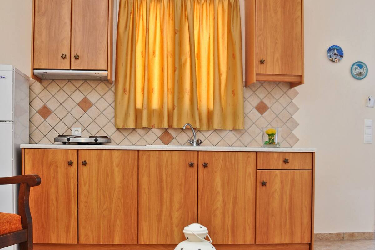 fridge, stovetop, electric kettle, high chair