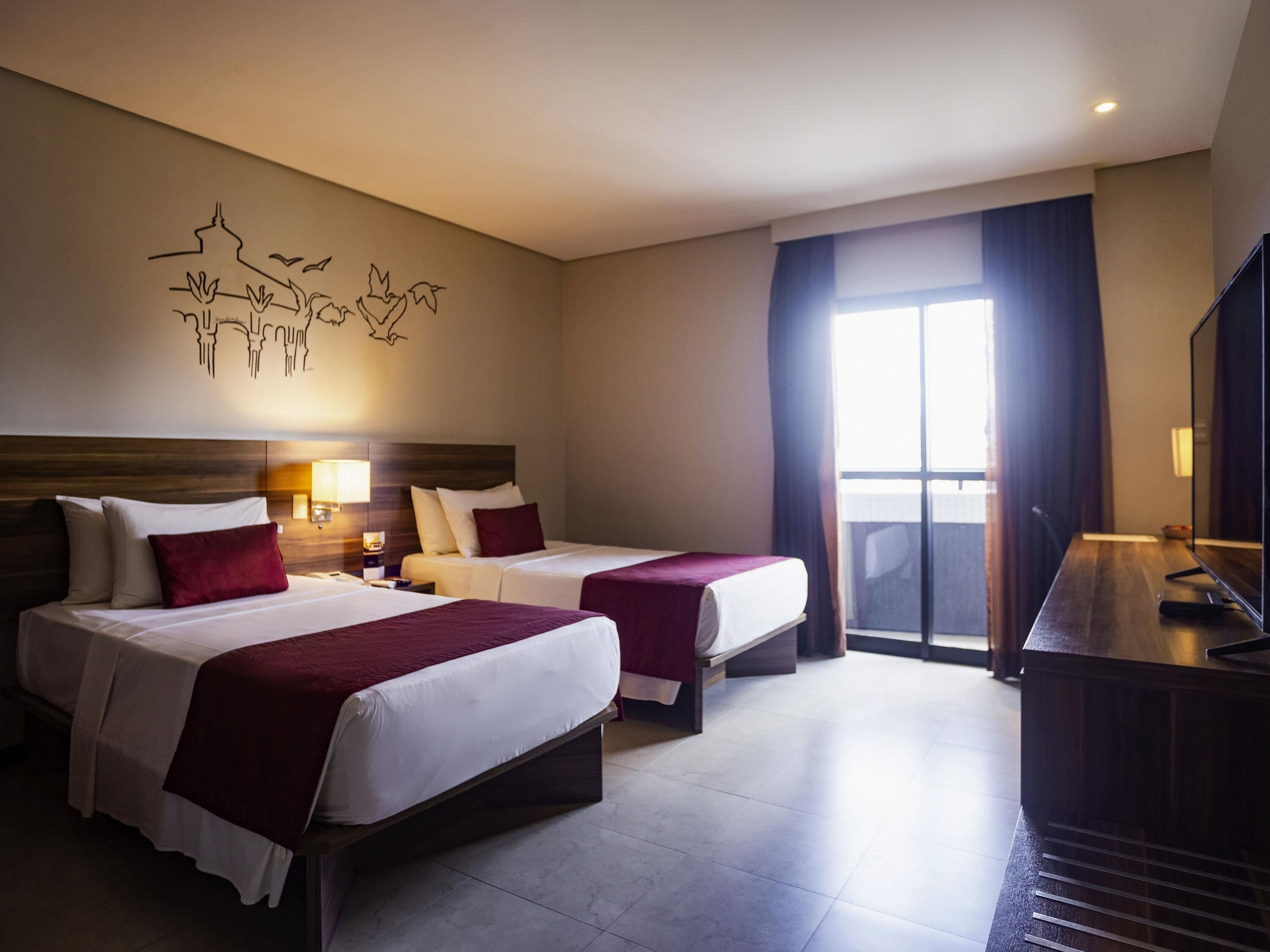 Quarto standard, 2 camas de solteiro | Frigobar, escrivaninha, Wi-Fi de cortesia, roupa de cama