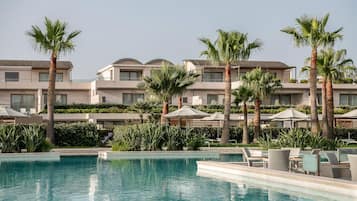 Indoor pool, 4 outdoor pools, open 9:00 AM to 7:00 PM, pool umbrellas