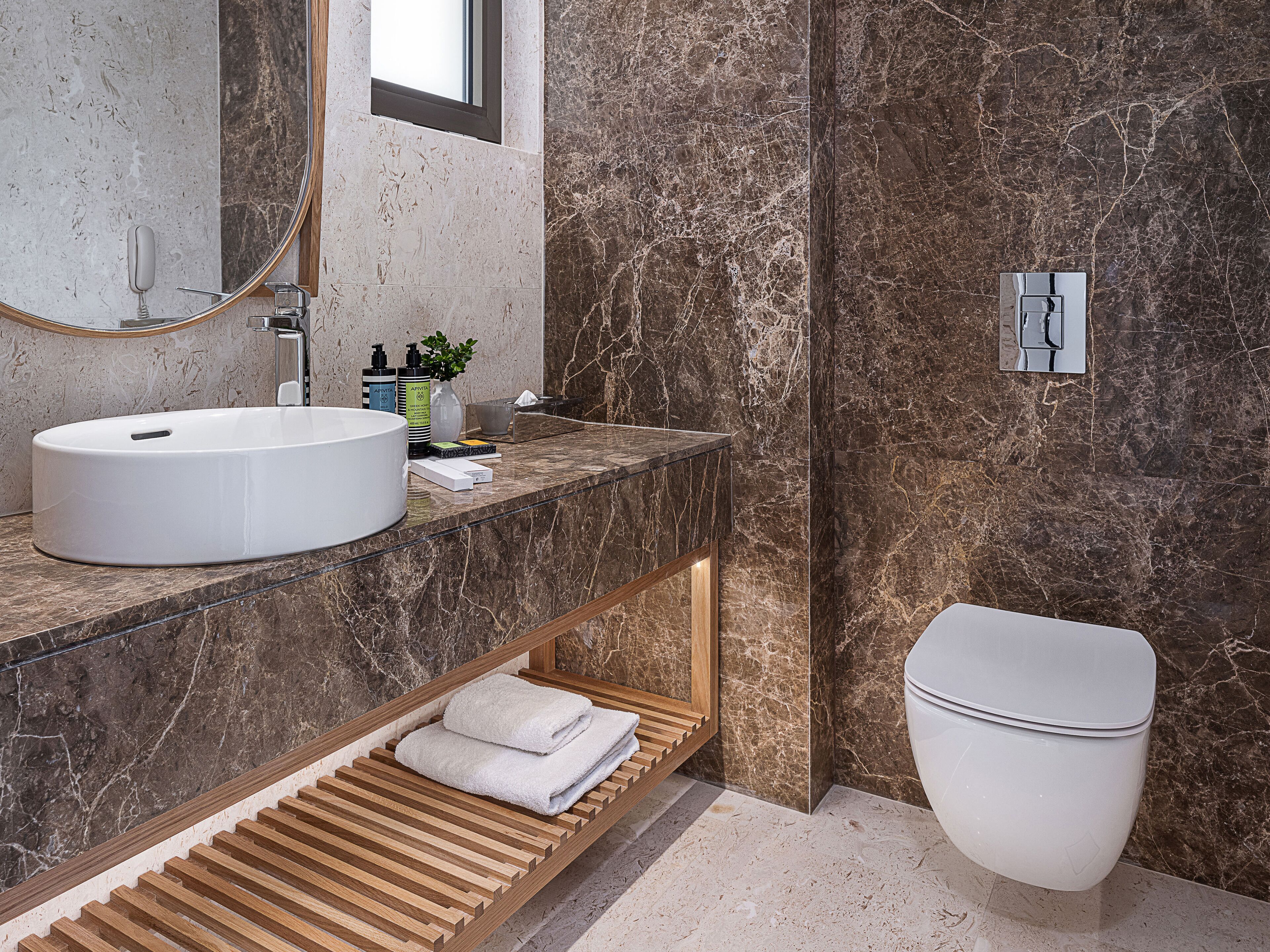 designer toiletries, hair dryer, bathrobes, slippers