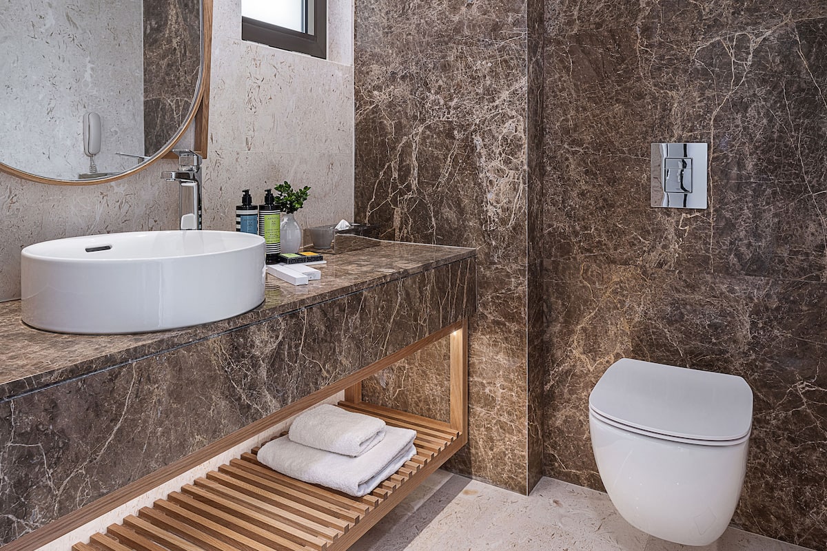 designer toiletries, hair dryer, bathrobes, slippers