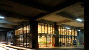 A modern building with large glass windows and a spacious interior. -  POP! Hotel Festival Citylink Bandung (Bandung)