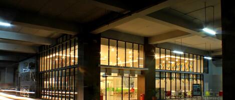 A modern building with large glass windows and a spacious interior.
