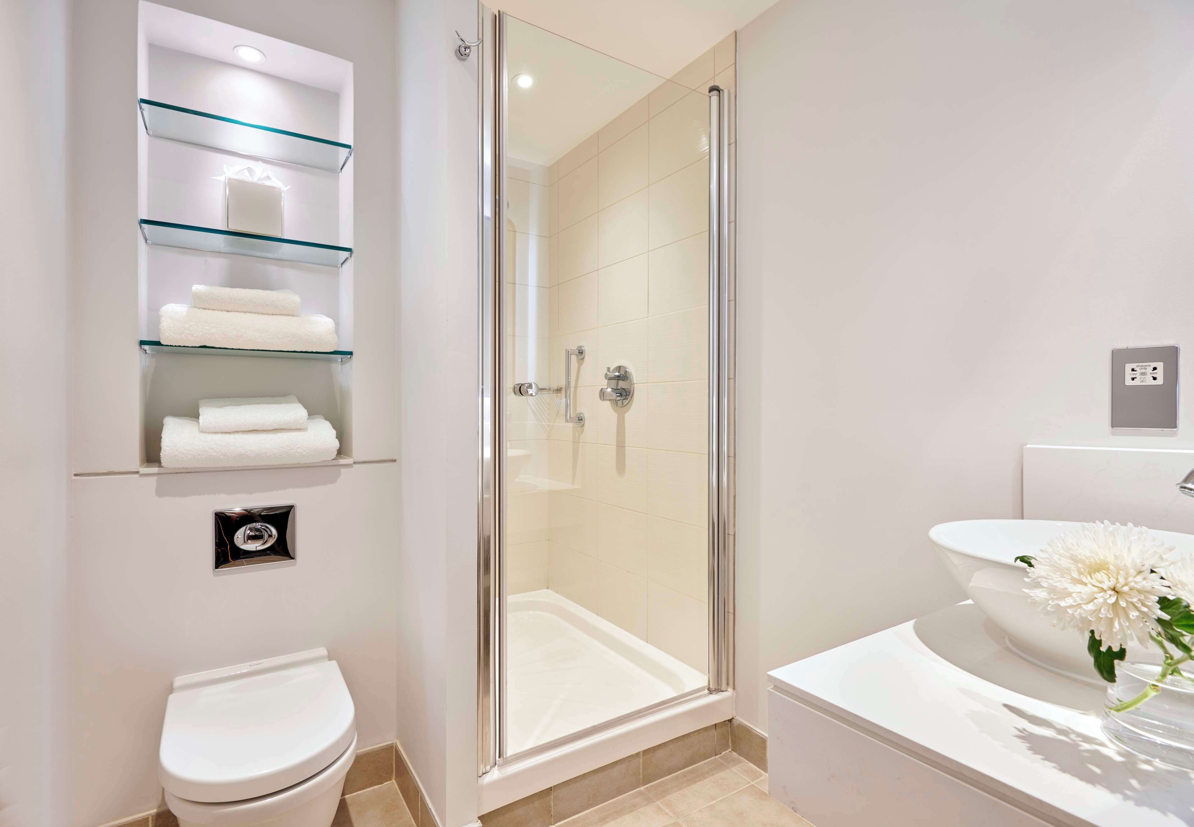 deluxe studio, 1 king bed | bathroom | shower, free toiletries, hair dryer, towels