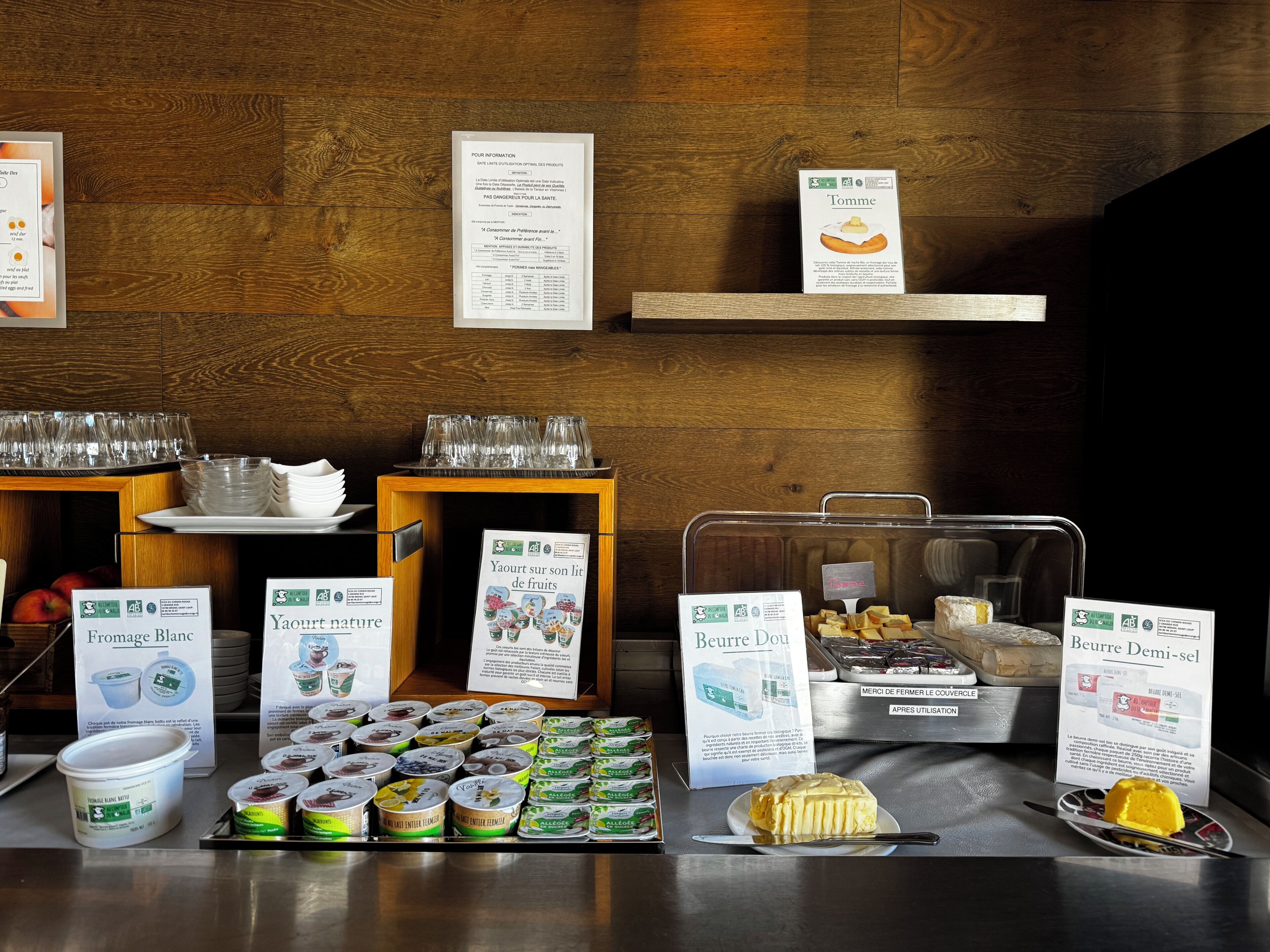 A breakfast buffet with various food items and beverages.
