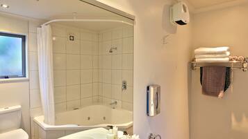 Studio Suite, Jetted Tub (FIFA World Cup Live Available) | Bathroom | Combined shower/tub, free toiletries, hair dryer, towels