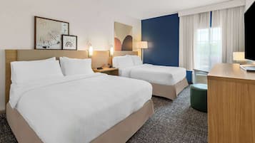 Premium bedding, pillow-top beds, desk, laptop workspace