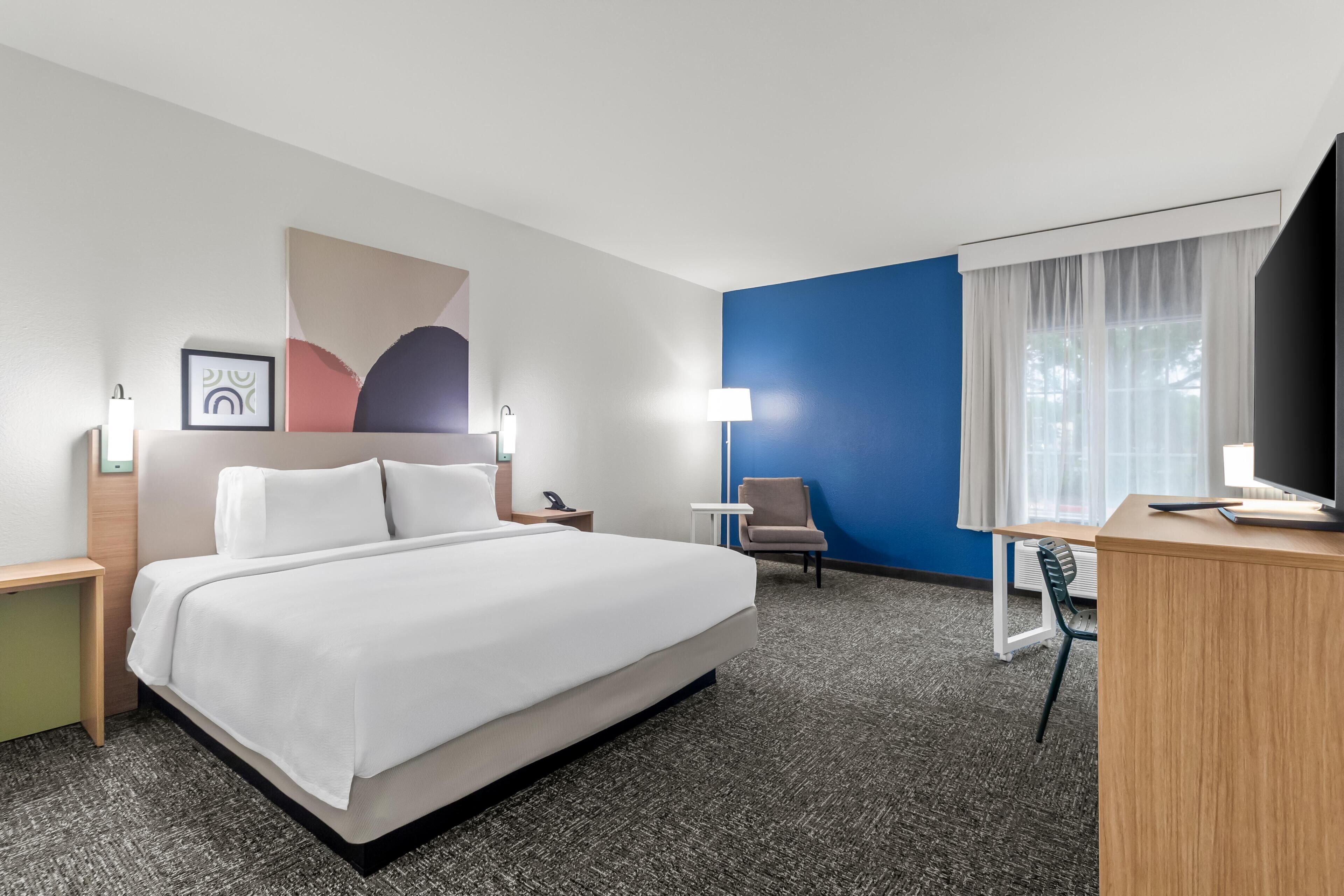 Premium bedding, pillow-top beds, desk, laptop workspace
