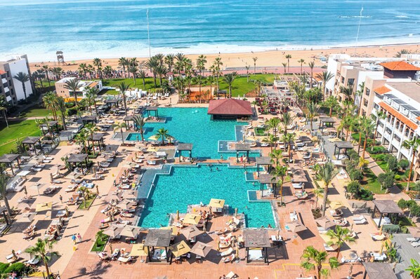 Indoor pool, outdoor pool, pool umbrellas, sun loungers
