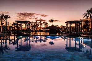 Indoor pool, outdoor pool, pool umbrellas, sun loungers