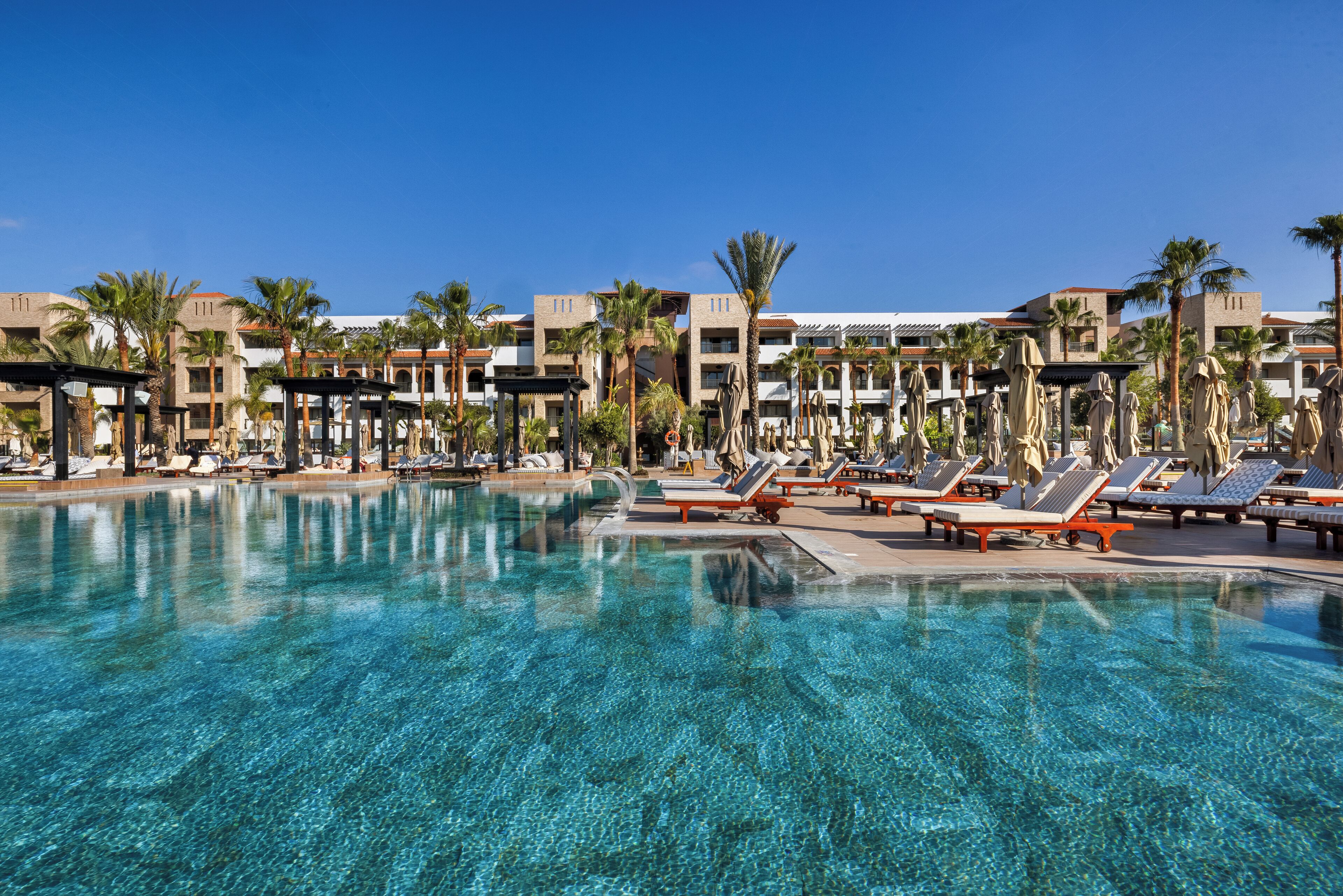 Indoor pool, outdoor pool, pool umbrellas, pool loungers