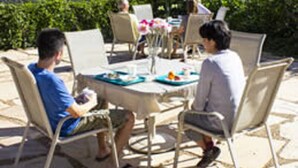 A table set outdoors with a mountain view in the background. - Ojai Retreat & Inn (Ojai)