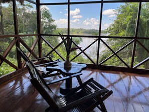 Deluxe Double or Twin Room, 1 Bedroom, River View | Living area | Books, stereo -  Andean Wings Sotupa Eco Lodge (Tambopata)