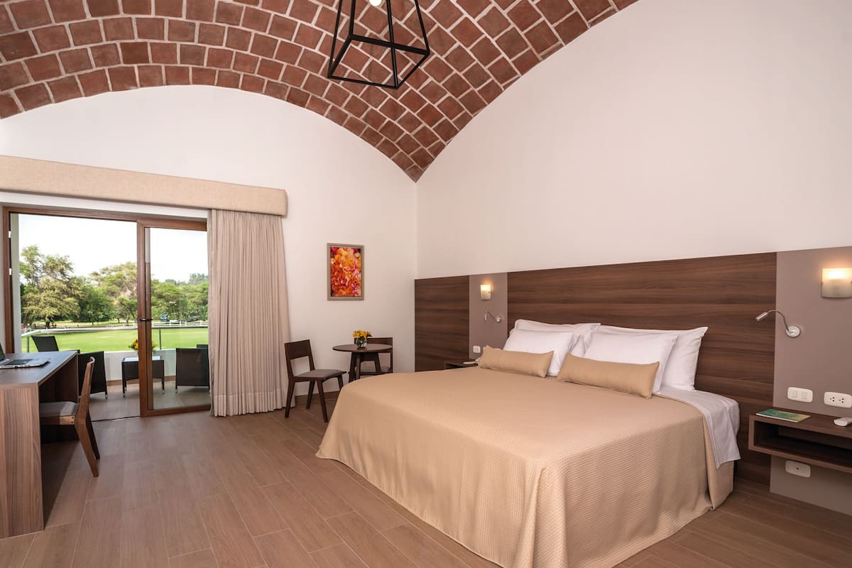 Deluxe Double Room | Minibar, in-room safe, desk, blackout curtains