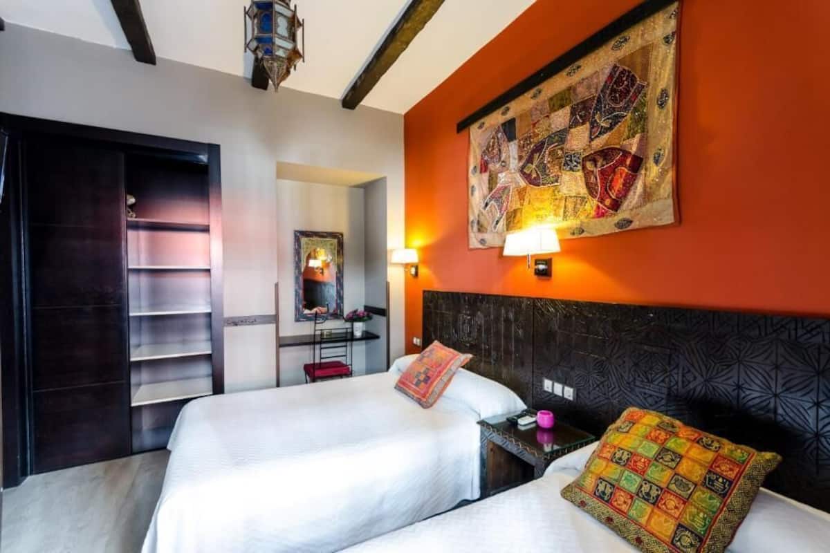 Triple Room | Down comforters, in-room safe, desk, blackout drapes