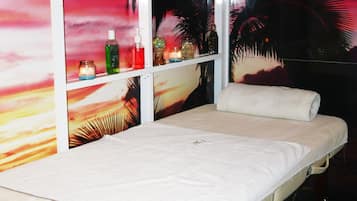 Relax in a cozy retreat with a comfortable bed and serene views of palm trees.