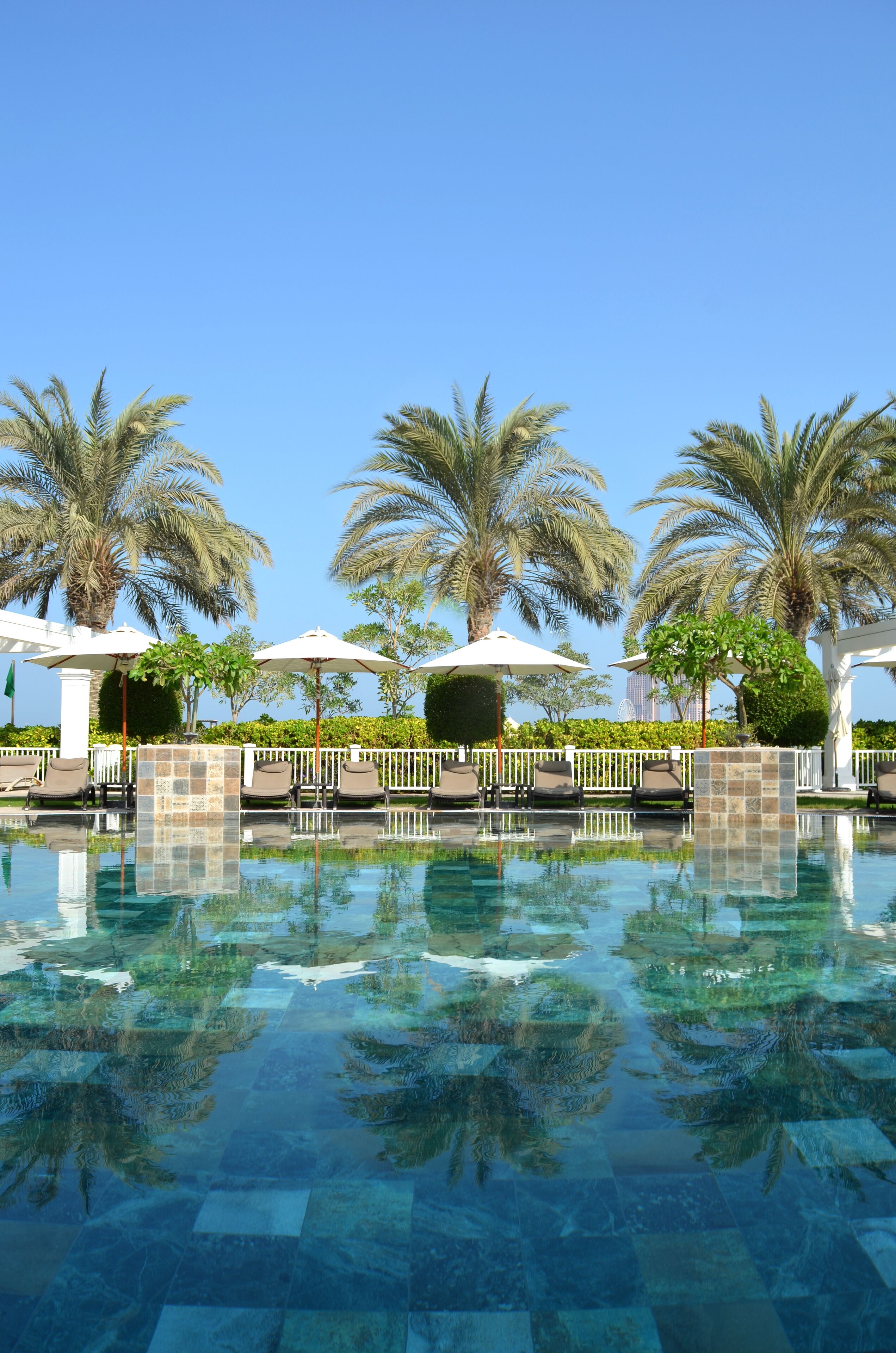 2 outdoor pools, open 8:00 AM to 8:00 PM, pool umbrellas, pool loungers