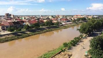 A river with a bridge and buildings along the riverbank.