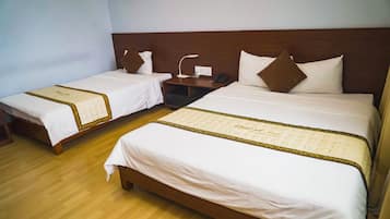 Triple Room | Minibar, in-room safe, desk, blackout drapes