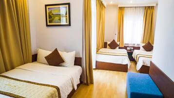 Triple Room | Minibar, in-room safe, desk, blackout curtains