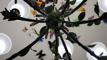 A chandelier with multiple arms and light fixtures.