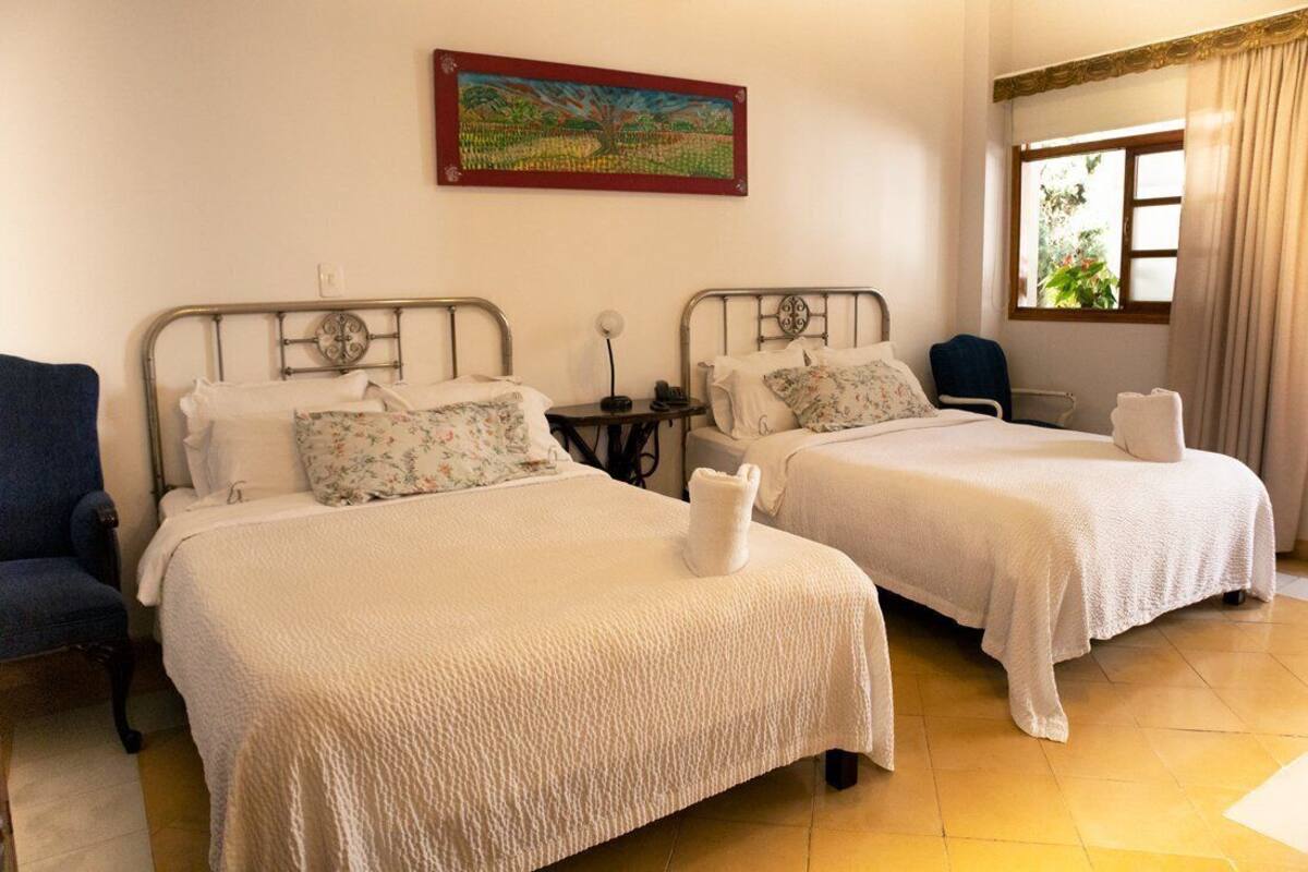 Family Triple Room | Premium bedding, down comforters, laptop workspace, blackout drapes
