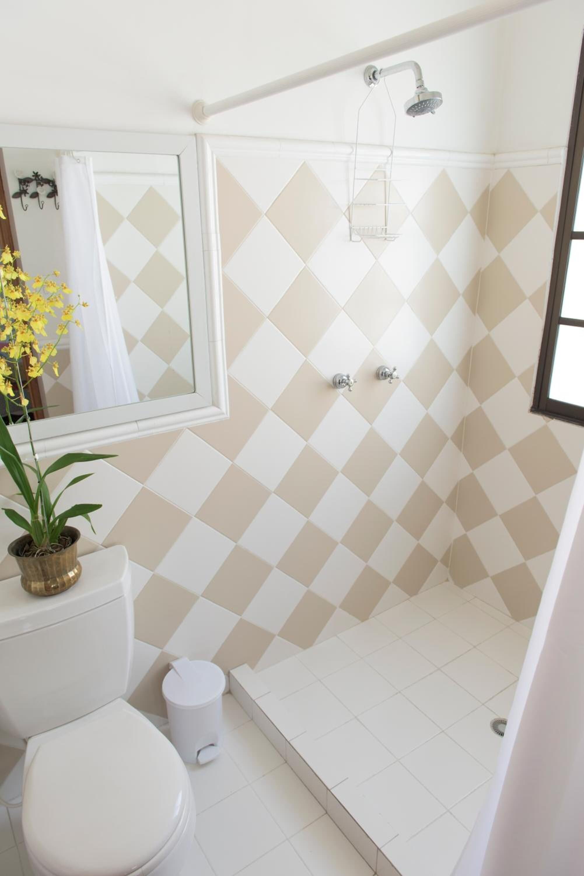 designer toiletries, hair dryer, towels