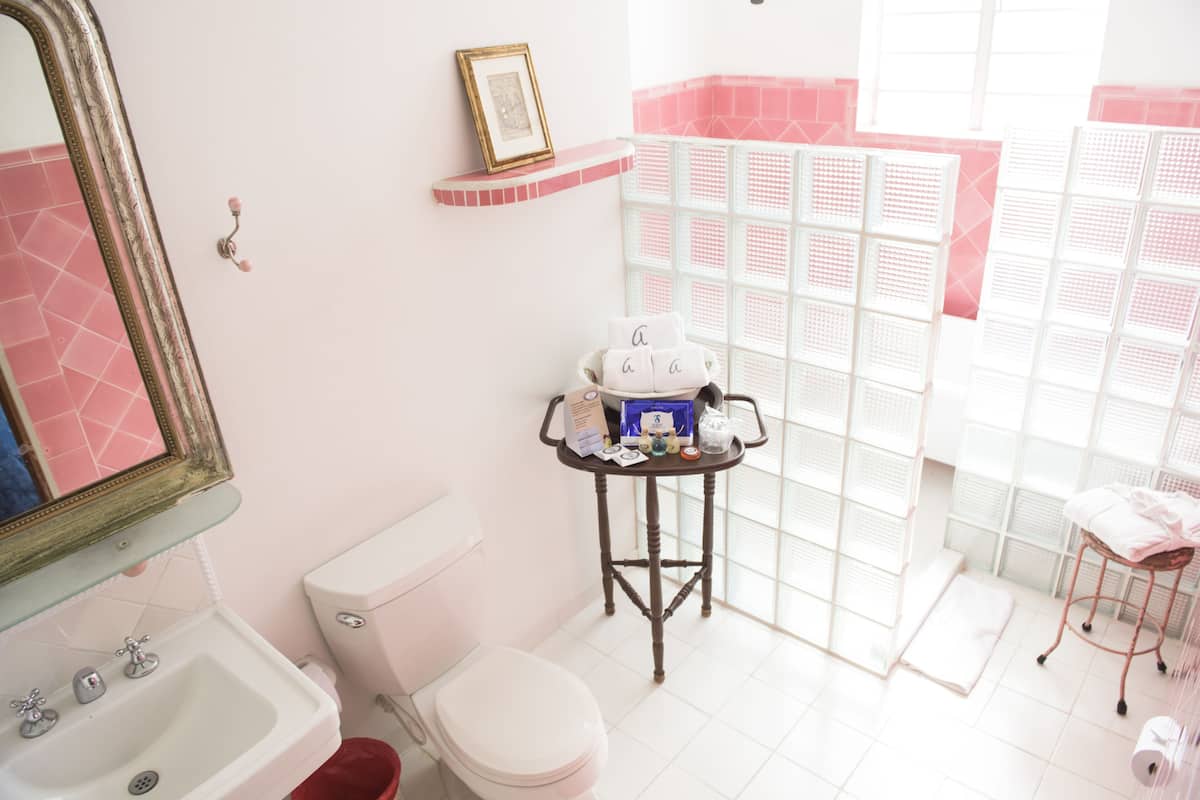 deluxe suite | bathroom | designer toiletries, hair dryer, towels