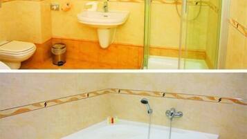 Ein Badezimmer mit Waschbecken, Toilette und einer Duschkabine.