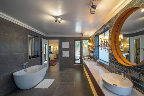 Luxury Suite, 1 King Bed | Bathroom | Separate bathtub and shower, deep-soaking bathtub, free toiletries