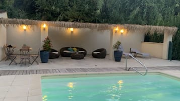 Seasonal outdoor pool, open 7:30 AM to 9:00 PM, pool umbrellas