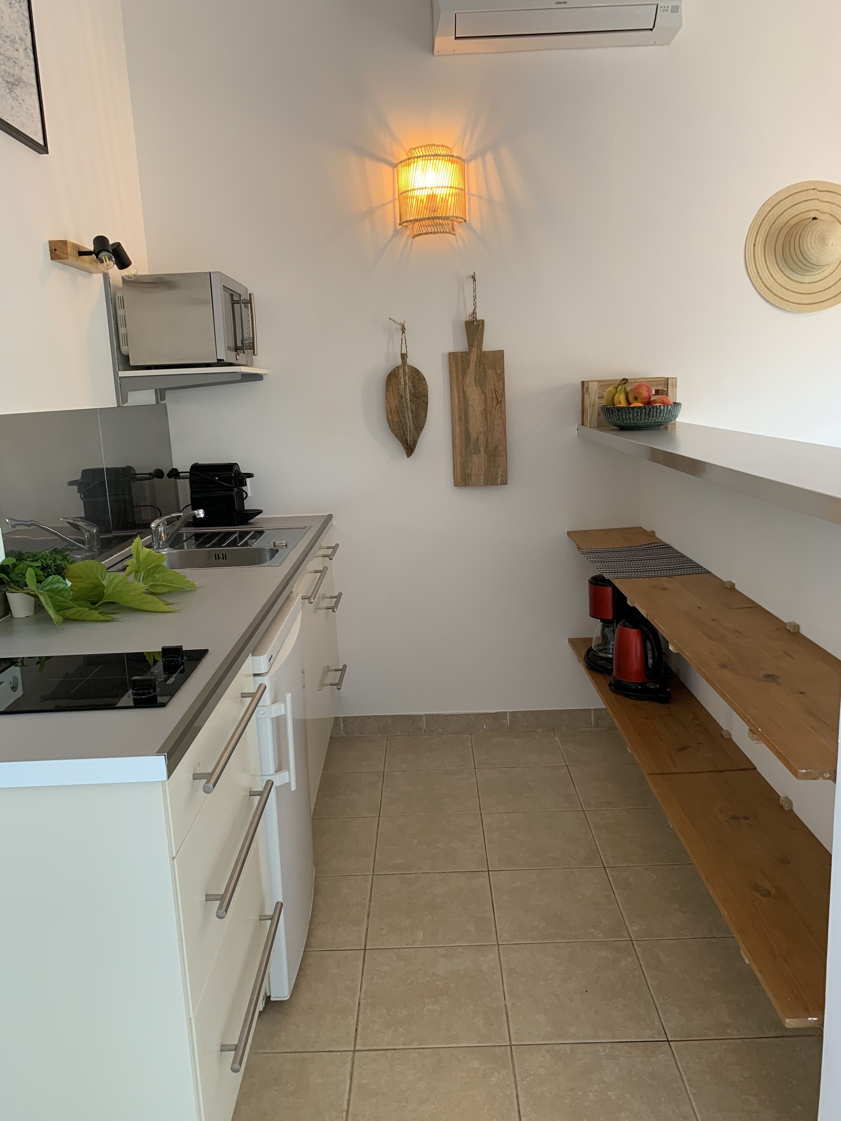 full-sized fridge, microwave, stovetop, espresso maker