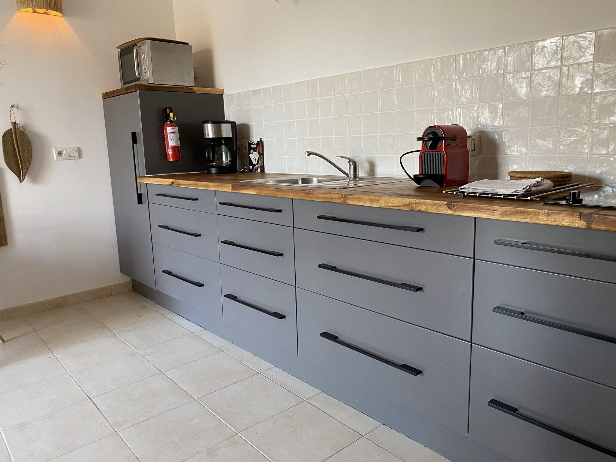 deluxe suite | private kitchen | full-sized fridge, microwave, stovetop, espresso maker