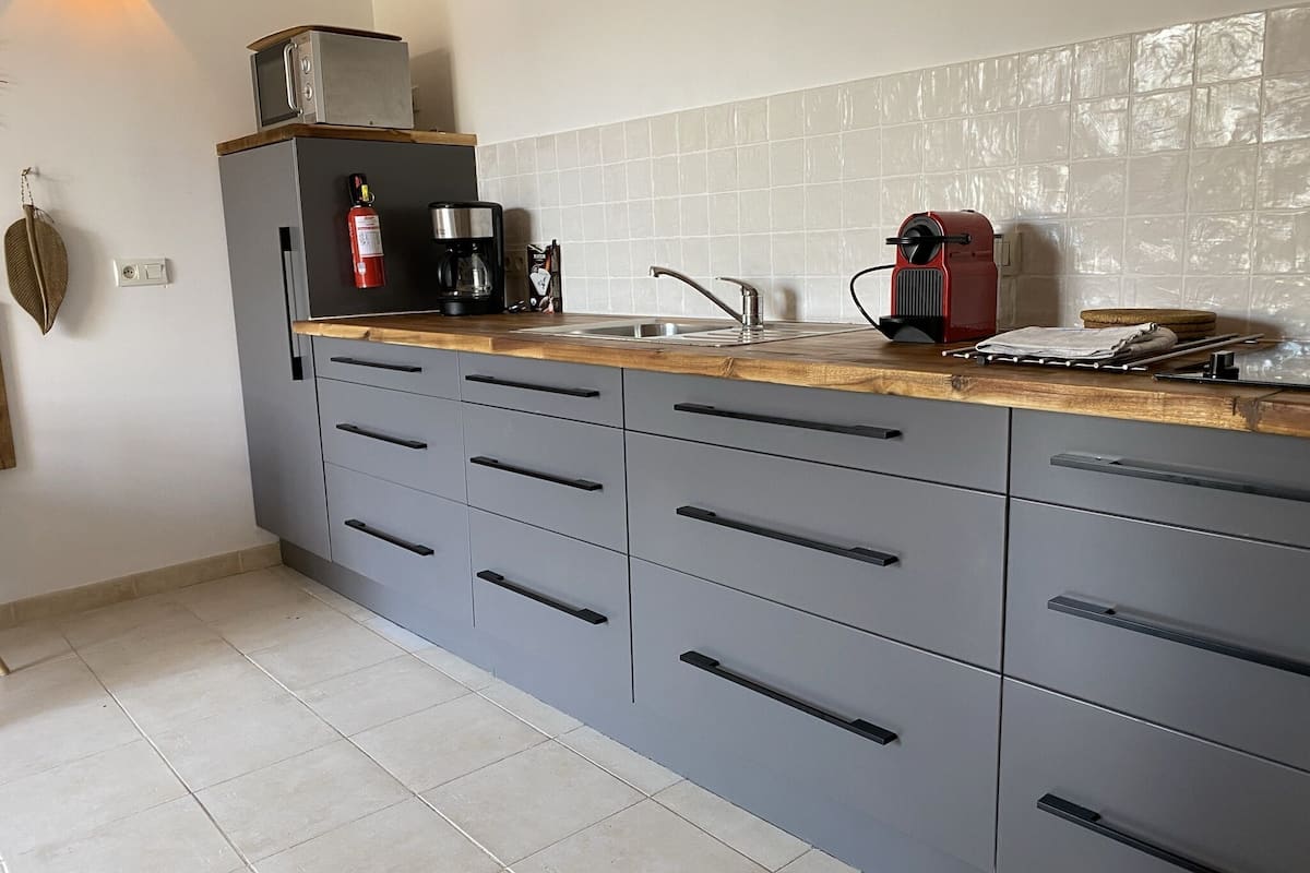 deluxe suite | private kitchen | full-sized fridge, microwave, stovetop, espresso maker