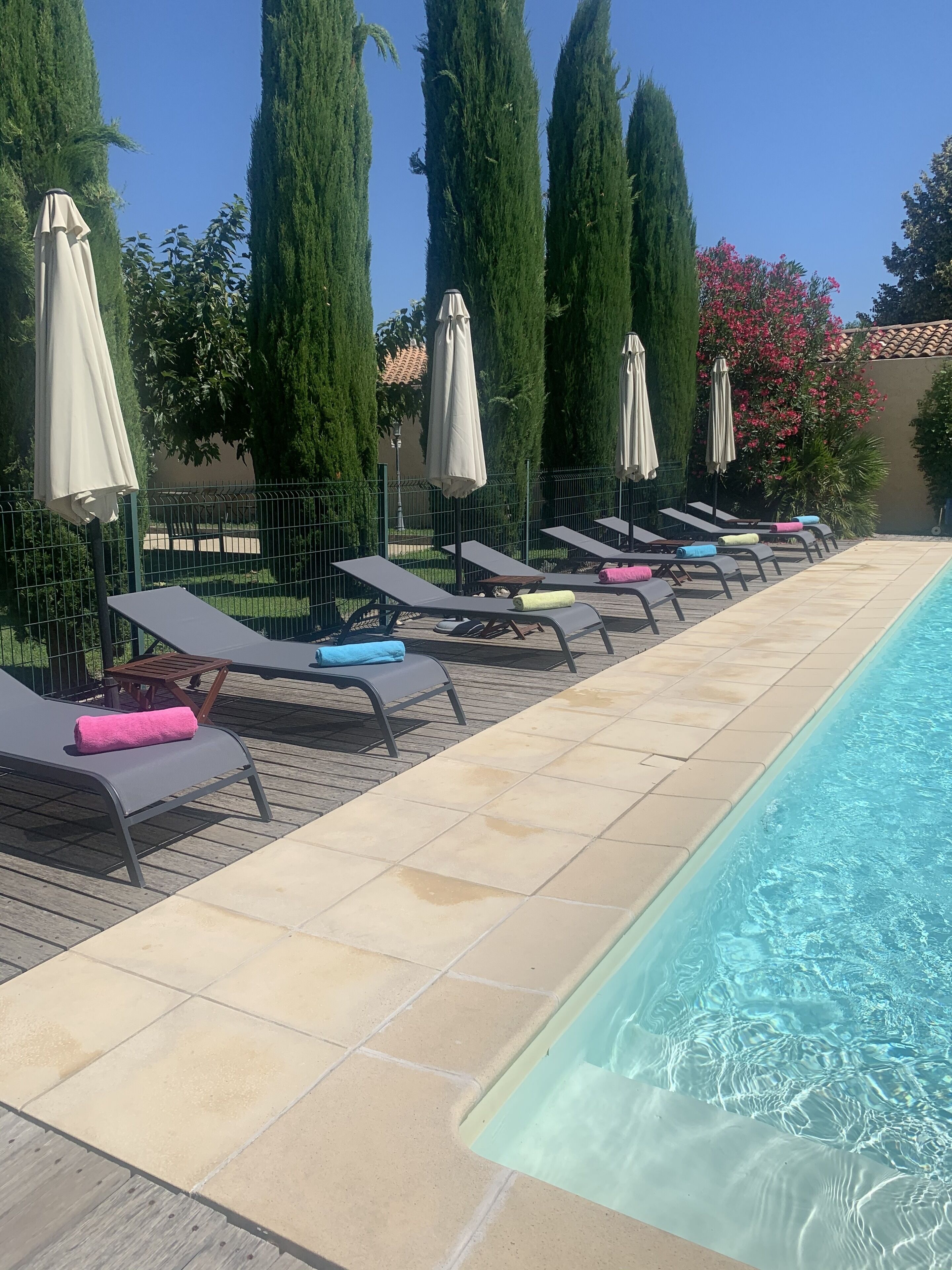 seasonal outdoor pool, open 7:30 am to 9:00 pm, pool umbrellas
