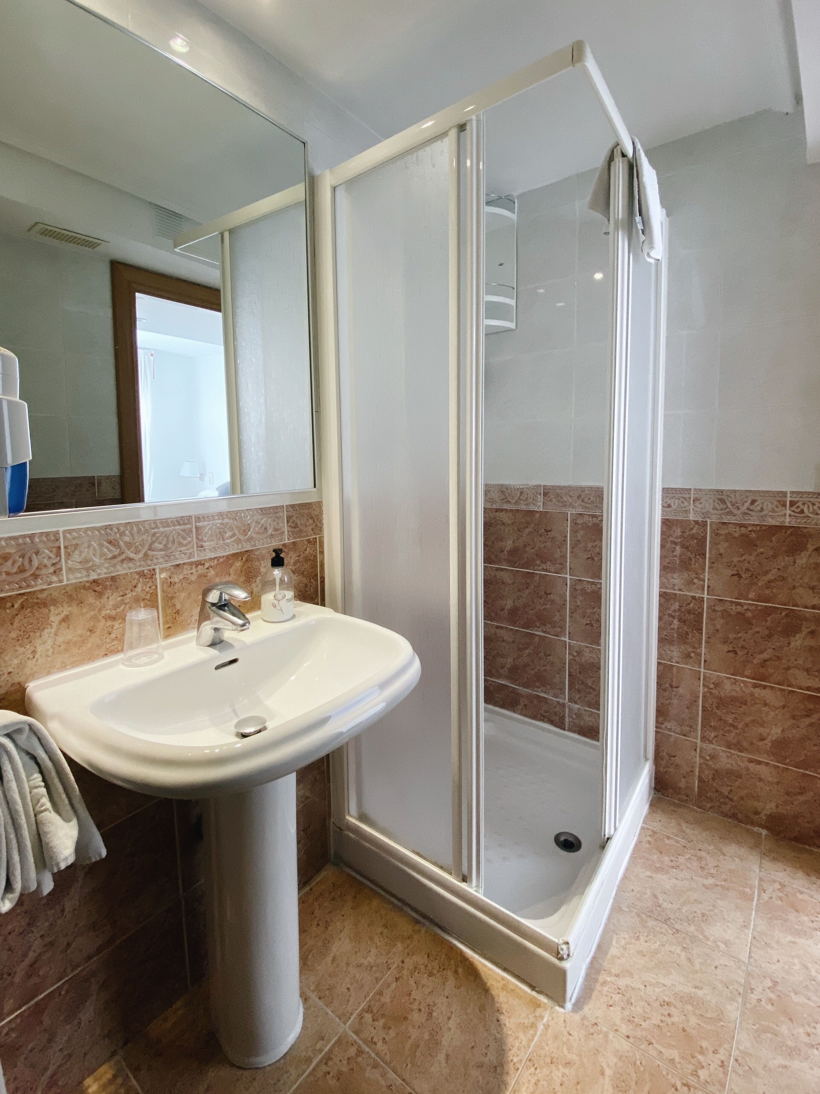 bathtub, free toiletries, hair dryer, towels