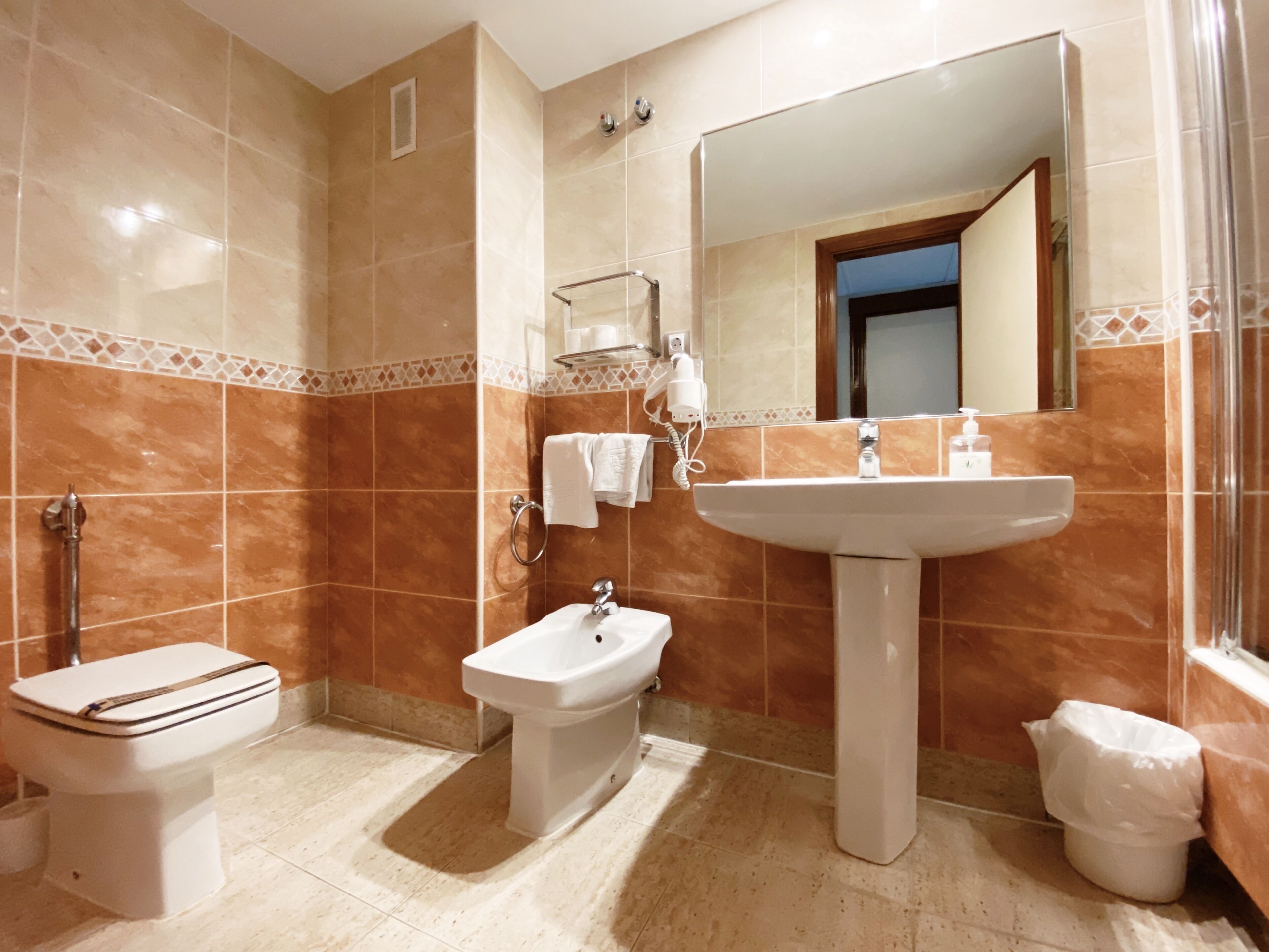 bathtub, free toiletries, hair dryer, towels