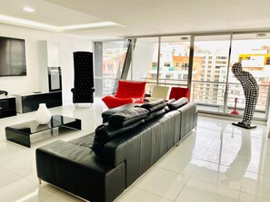 Family Apartment, 3 Bedrooms, Kitchen, City View | Living area | 32-inch flat-screen TV with cable channels, TV, DVD player