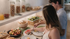 A buffet setup with various food items including fruits, nuts, and pastries. - I Mulicchi (Specchia)