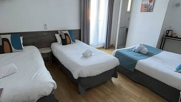Economy Quadruple Room, Multiple Beds | Desk, iron/ironing board, free WiFi, bed sheets